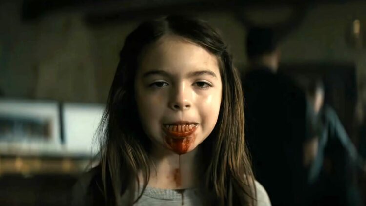 katie with her jaw portruding and blooding leaking out of it in the mummy